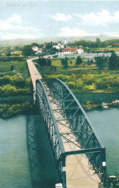 Stara razglednica s podobo železnega mostu čez Krko